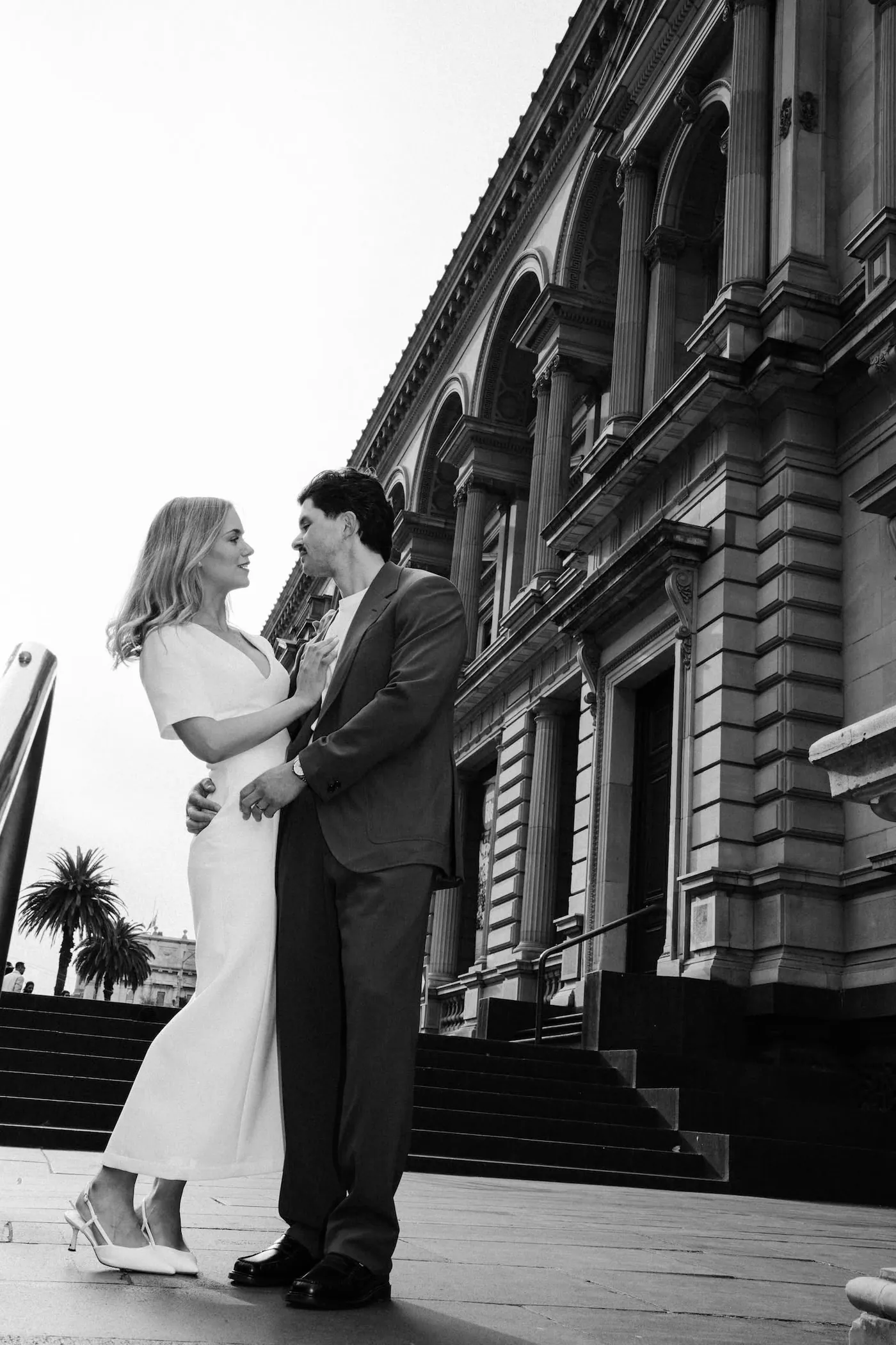 Black and white couple portrait on city steps